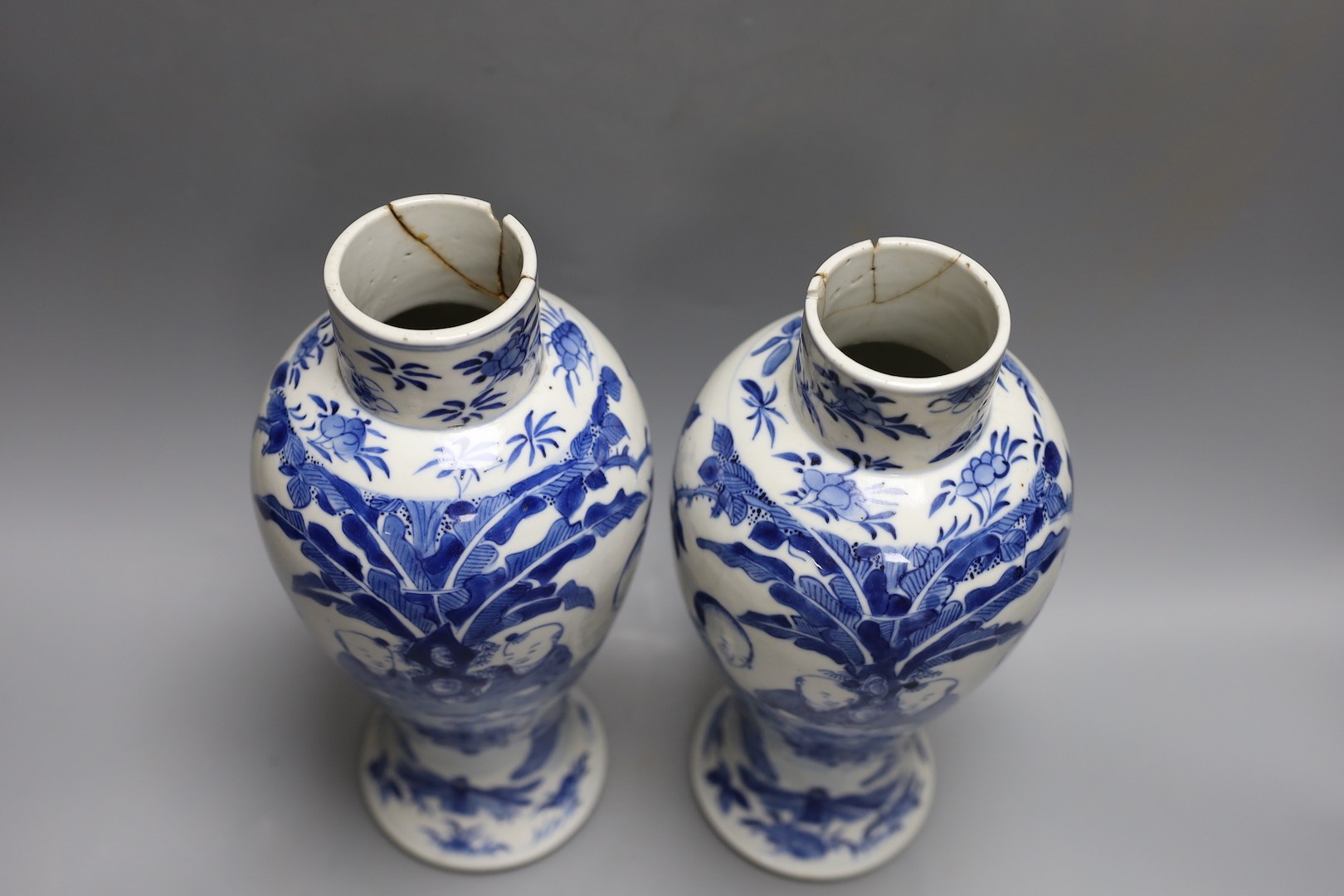 A pair of Chinese blue and white ‘boys’ baluster vases and a Chinese blue and white jar, 19th-century and later 27cm